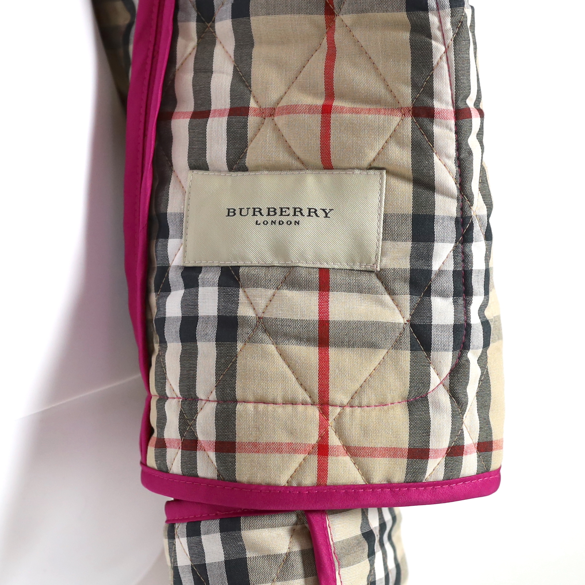 Two Burberry lady's quilted jackets, one pink and the other green, size Medium